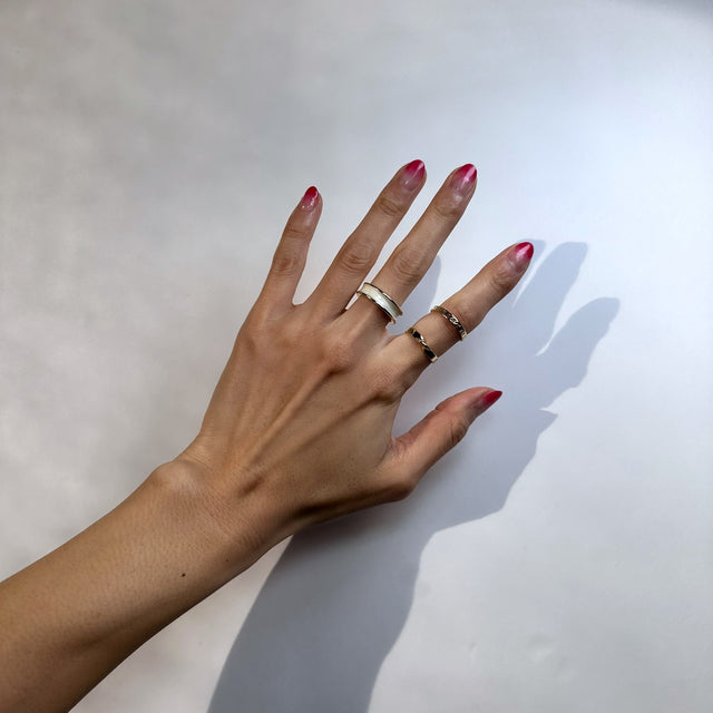 Chic and versatile Caelia Ring Set: 14k gold-plated trio with unique shapes and adjustable sizing for a perfect fit on any finger. Ideal for layering or standalone wear, radiating delicate and modern beauty, adding sophistication to daily style.