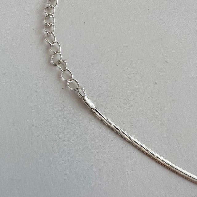 A versatile sterling silver necklace set with dual chain styles, offering the flexibility to wear each chain separately or together for a stylish layered look. This exquisite set embodies elegance and can be cherished individually or shared as a symbol of connection