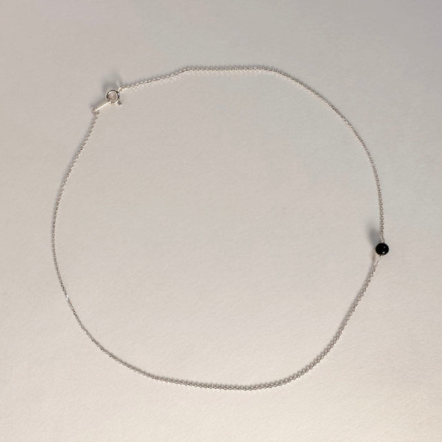 A stunning sterling silver choker, delicately crafted to grace your neck with timeless elegance. This versatile accessory exudes sophistication and adds a touch of refined charm to any outfit, making it a must-have piece for your jewelry collection