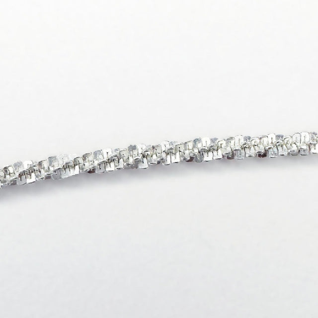 A dainty and sophisticated sterling silver flower chain bracelet, showcasing a unique and captivating design. Its delicate floral motifs delicately intertwine, creating an enchanting and elegant accessory that effortlessly elevates your style.